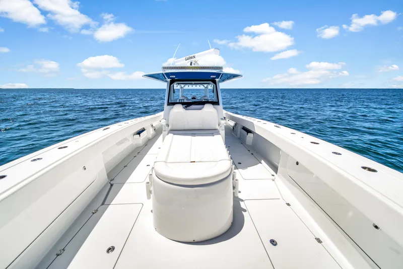 Slide: The Image of 2023 Freeman 47 boat on open sea under blue sky with clouds. - 33