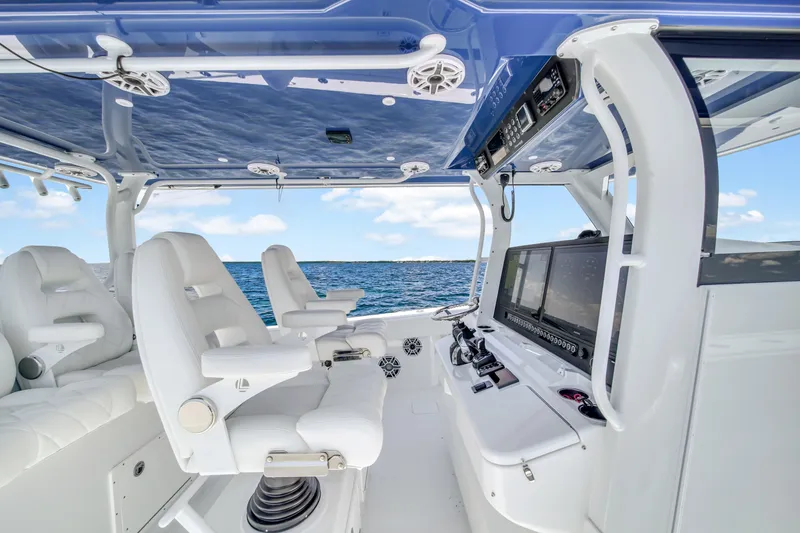 Slide: The Image of 2023 Freeman 47 boat interior with white seating and advanced navigation systems. - 37