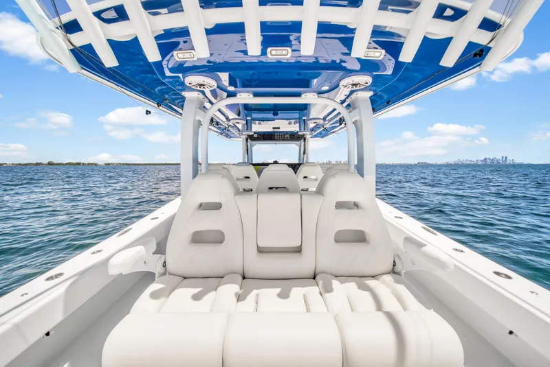 Slide: The Image of Luxury Freeman 47 boat interior, 2023 model, featuring spacious seating and sleek design on open water. - 46