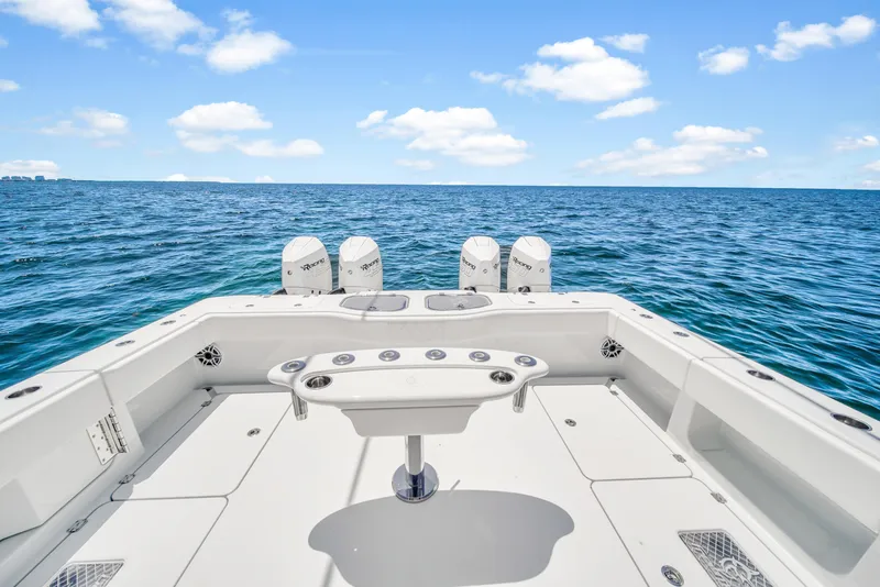 Slide: The Image of 2023 Freeman 47 boat on open sea with clear blue skies. - 47