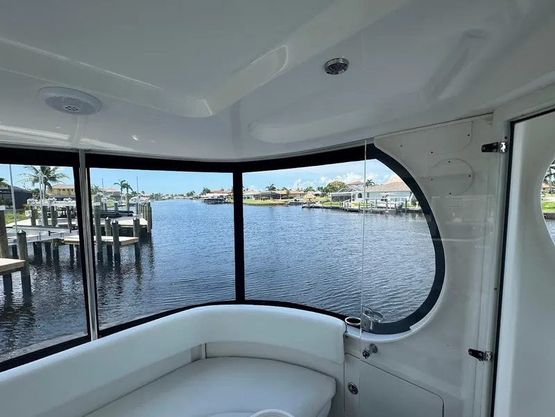 Slide: The Image of Interior view of 2006 Sea Ray 40 Motor Yacht overlooking serene waterfront. - 10