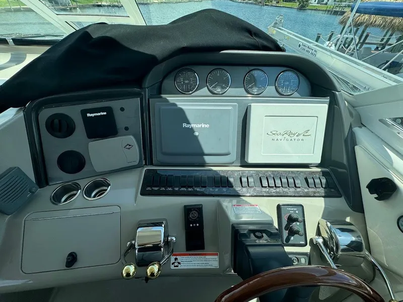 Slide: The Image of 2006 Sea Ray 40 Motor Yacht helm with Raymarine navigation system and gauges. - 15