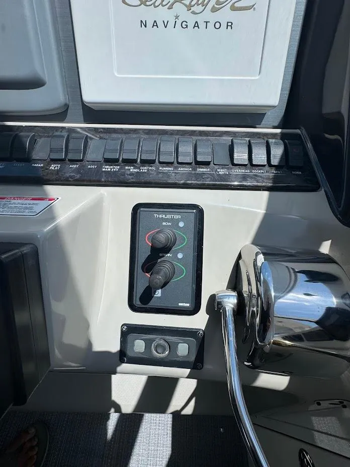 Slide: The Image of Control panel of a 2006 Sea Ray 40 Motor Yacht with throttle and switches. - 19