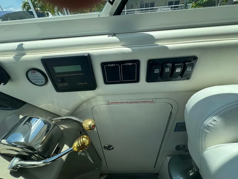 Slide: The Image of Control panel of a 2006 Sea Ray 40 Motor Yacht with switches and gauges. - 20