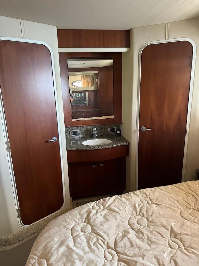 Slide: The Image of Interior of 2006 Sea Ray 40 Motor Yacht with wood cabinetry and sink. - 27