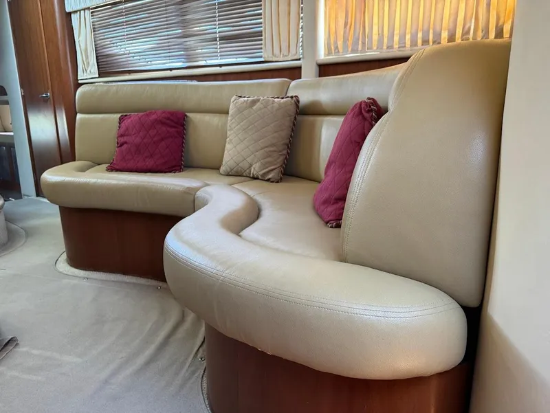 Slide: The Image of Luxurious beige leather seating with cushions in a 2006 Sea Ray 40 Motor Yacht interior. - 34