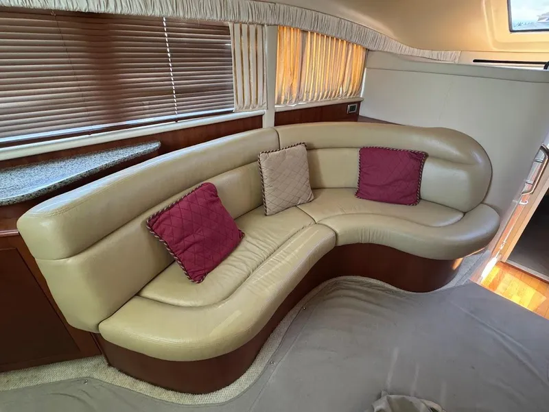Slide: The Image of Luxurious interior of 2006 Sea Ray 40 Motor Yacht with curved leather seating and decorative pillows. - 35
