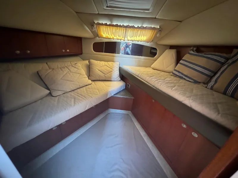 Slide: The Image of 2006 Sea Ray 40 Motor Yacht interior cabin with cozy seating and cushions. - 38