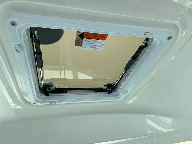 Slide: The Image of Hatch window on 2006 Sea Ray 40 Motor Yacht, open with visible hinges and latches. - 40