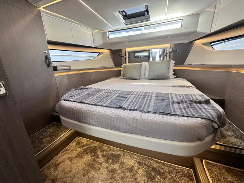 Slide: The Image of Luxurious interior of 2025 Jeanneau 1295 yacht with modern bedroom design. - 19