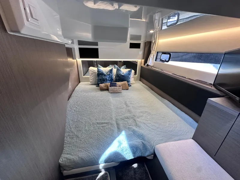 Slide: The Image of Luxurious interior cabin of 2025 Jeanneau 1295 yacht with modern bedding and ambient lighting. - 20