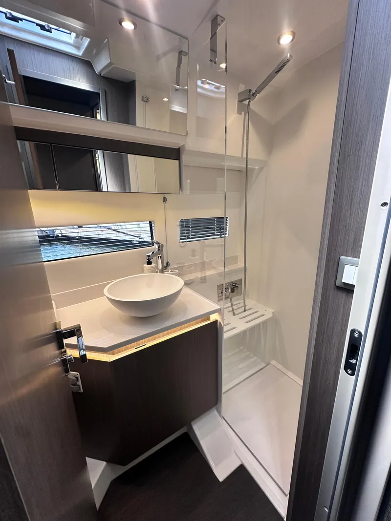 Slide: The Image of Modern bathroom in 2025 Jeanneau 1295 yacht with sleek fixtures and elegant design. - 22