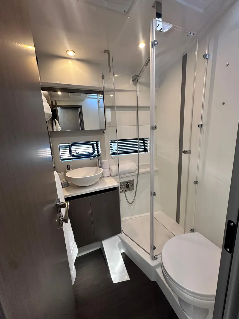 Slide: The Image of Modern bathroom in 2025 Jeanneau 1295 yacht with sleek fixtures and glass shower. - 23