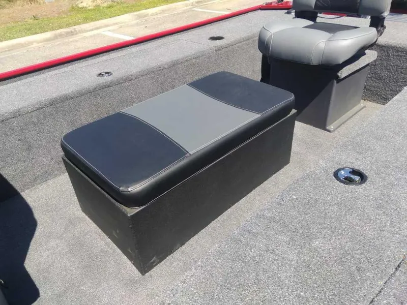 Slide: The Image of 2025 Tracker Panfish 17 boat interior with gray seating and storage compartment. - 10