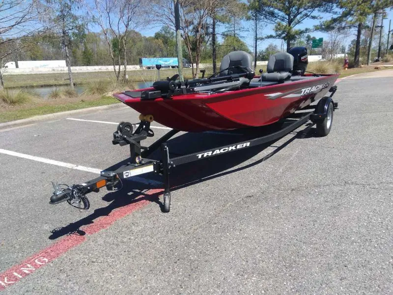 Slide: The Image of 2025 Tracker Panfish 17 boat on trailer in parking lot. - 13