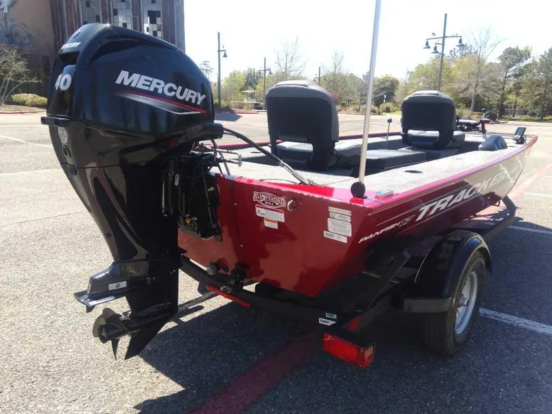 Slide: The Image of 2025 Tracker Panfish 17 boat with Mercury engine in parking lot. - 3