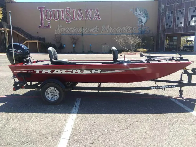 Slide: The Image of 2025 Tracker Panfish 17 boat in parking lot, Louisiana Sportsman's Paradise backdrop. - 4