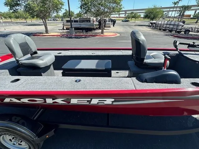 Slide: The Image of 2025 Tracker Panfish 17 boat with seating, parked outdoors on a sunny day. - 3