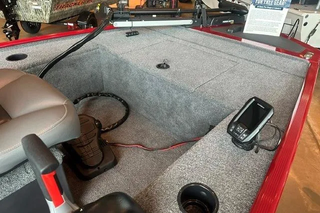 Slide: The Image of 2025 Tracker Panfish 17 boat interior with seating, control panel, and fish finder. - 8