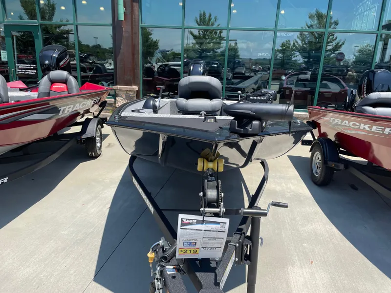 Slide: The Image of 2025 Tracker Panfish 17 boat displayed outdoors with other Tracker models. - 2