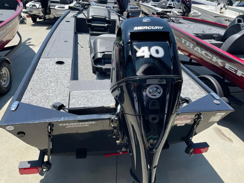 Slide: The Image of 2025 Tracker Panfish 17 boat with Mercury 40 engine, displayed outdoors. - 3