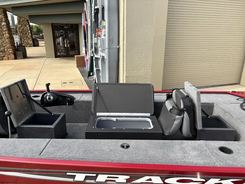 Slide: The Image of 2025 Tracker Panfish 17 boat interior with storage compartments and seating. - 2