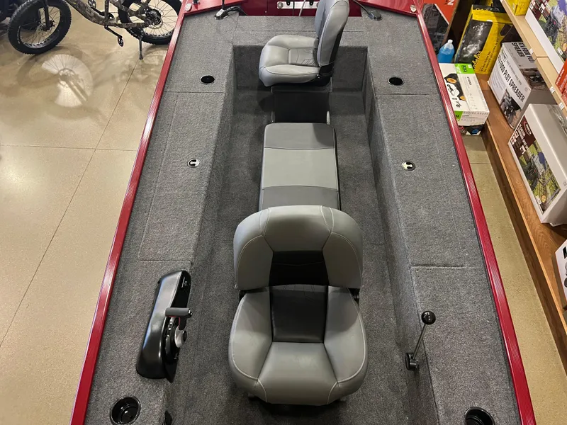 Slide: The Image of 2025 Tracker Panfish 17 boat interior with gray seating and carpeted flooring. - 4