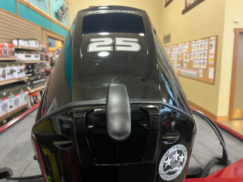 Slide: The Image of 2025 Tracker Panfish 17 boat motor with "25" marking in a showroom. - 5
