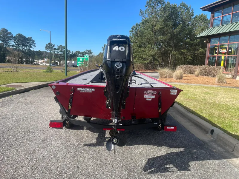 Slide: The Image of 2025 Tracker Panfish 17 boat with 40 HP motor, parked outdoors. - 4