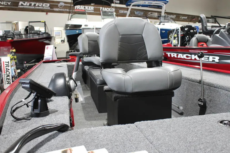 Slide: The Image of 2025 Tracker Panfish 17 boat interior with gray seating and navigation equipment. - 10