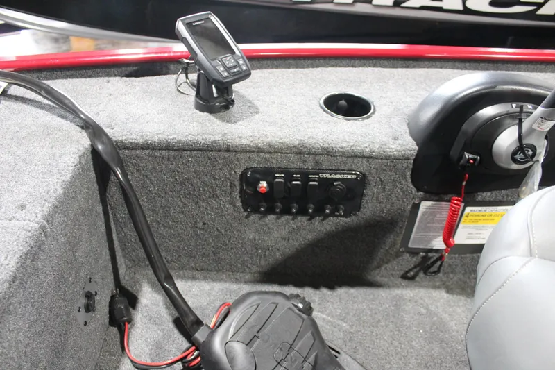 Slide: The Image of 2025 Tracker Panfish 17 boat dashboard with control panel and electronic display. - 17