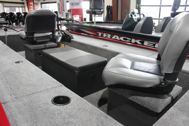 Slide: The Image of 2025 Tracker Panfish 17 boat interior with seating and storage compartments. - 7