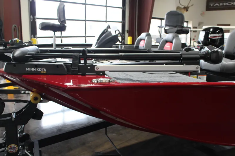 Slide: The Image of 2025 Tracker Panfish 17 boat with Minn Kota trolling motor in showroom. - 9