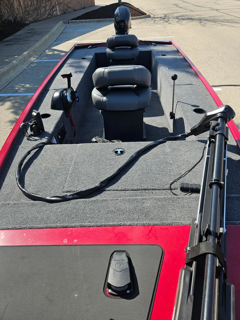 Slide: The Image of 2025 Tracker Panfish 17 boat interior with seating and fishing equipment. - 2