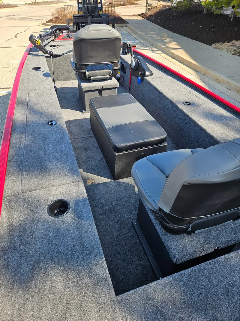 Slide: The Image of 2025 Tracker Panfish 17 boat interior with seating and storage, featuring a sleek design. - 3