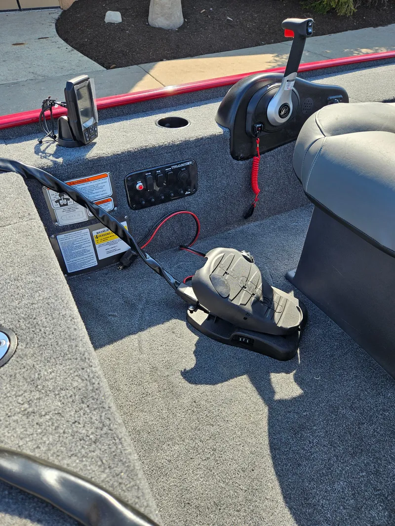 Slide: The Image of 2025 Tracker Panfish 17 boat interior with control panel and foot pedal. - 4