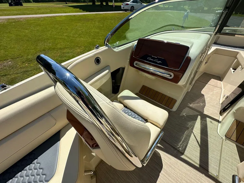 Slide: The Image of 2023 Chris-Craft Launch 25 GT interior with luxurious seating and polished chrome details. - 11