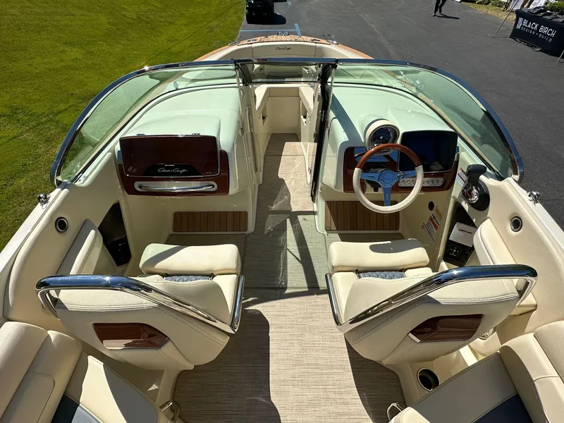 Slide: The Image of 2023 Chris-Craft Launch 25 GT interior with elegant seating and modern dashboard. - 6