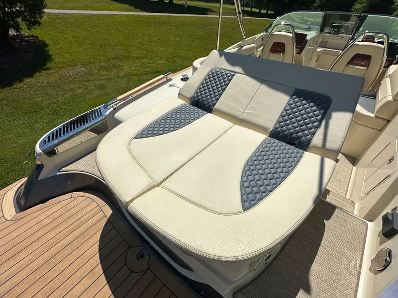 Slide: The Image of 2023 Chris-Craft Launch 25 GT boat with luxurious seating and elegant design. - 7