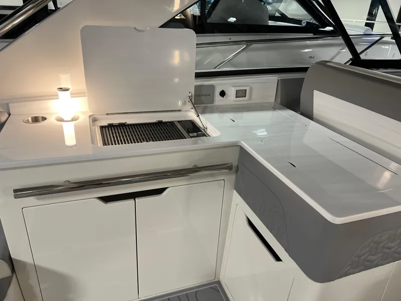 Slide: The Image of 2025 Regal LS36 boat interior with sleek kitchen area and modern appliances. - 15