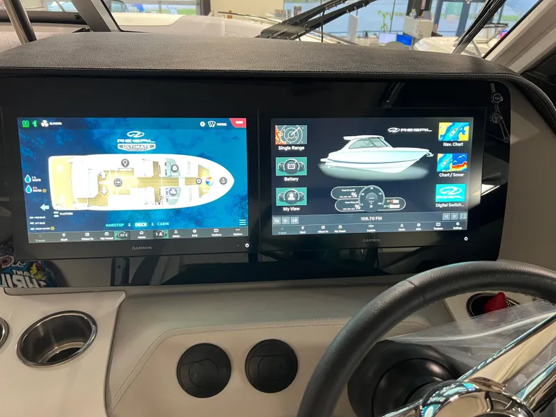 Slide: The Image of Dashboard of 2025 Regal LS36 boat with dual Garmin displays showing navigation and controls. - 17