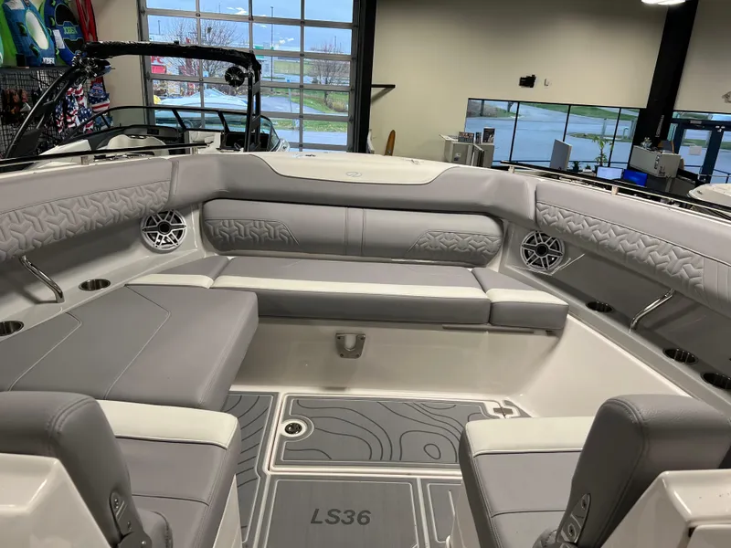 Slide: The Image of 2025 Regal LS36 boat interior with gray seating and modern design. - 20
