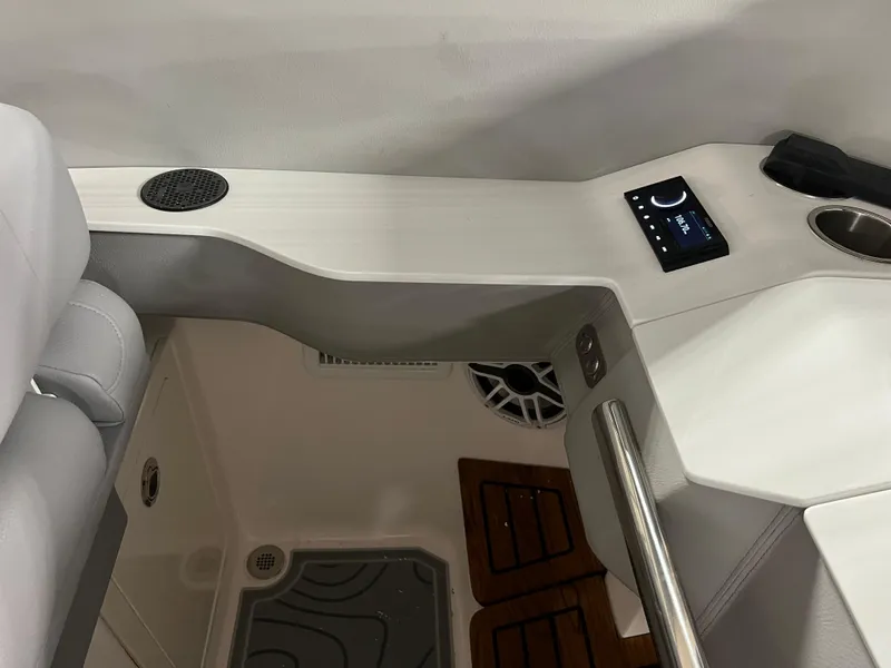 Slide: The Image of Interior of 2025 Regal LS36 boat with modern controls and sleek design. - 24