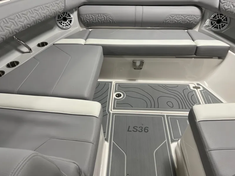 Slide: The Image of 2025 Regal LS36 boat interior with gray seating and stylish flooring. - 26