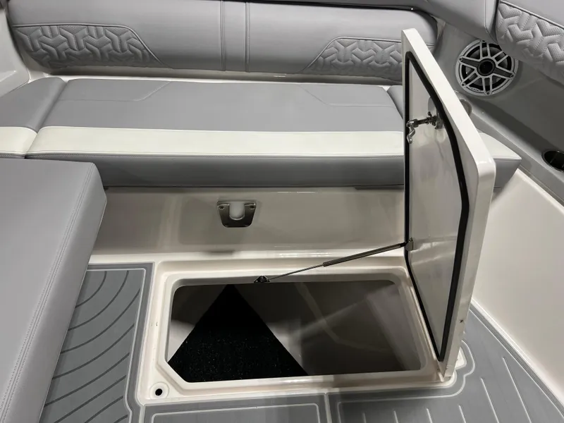 Slide: The Image of 2025 Regal LS36 boat interior with open storage compartment and stylish seating. - 27