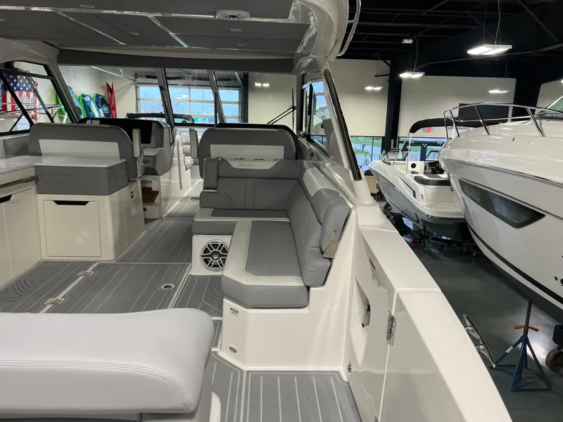 Slide: The Image of Interior of 2025 Regal LS36 boat with modern seating and sleek design. - 5