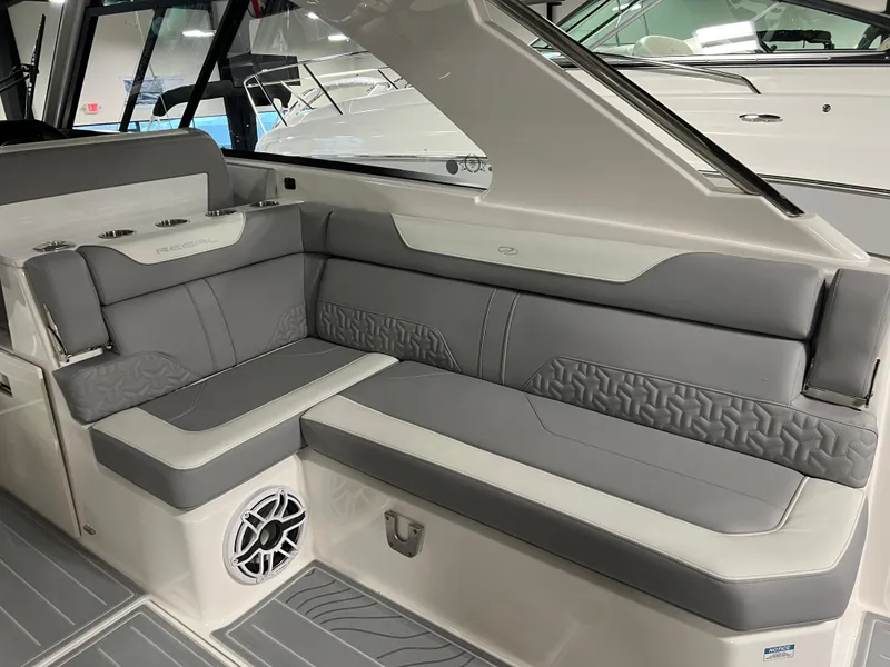 Slide: The Image of Luxurious seating area on the 2025 Regal LS36 boat, featuring modern gray upholstery. - 7