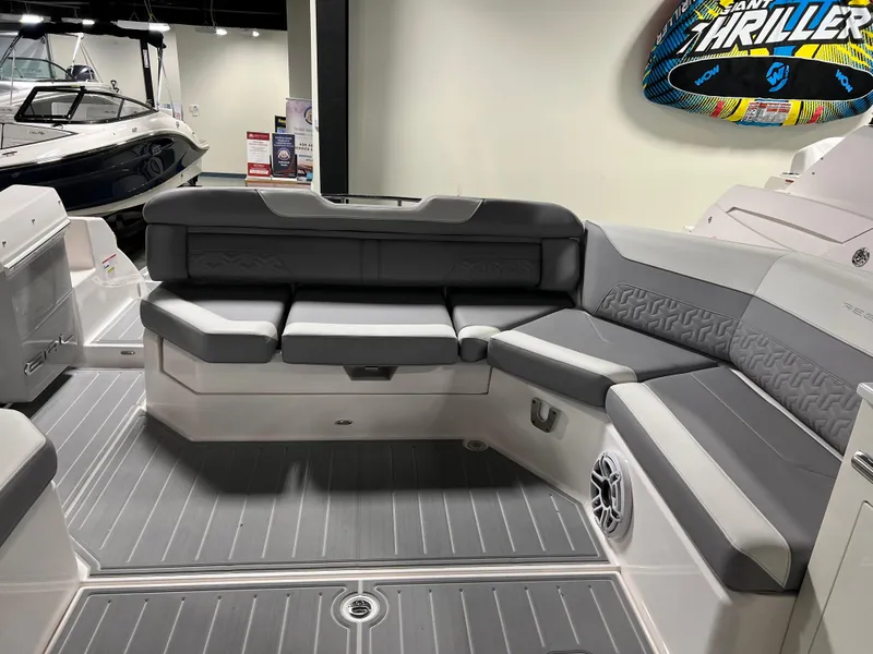 Slide: The Image of 2025 Regal LS36 boat interior with gray seating and sleek design. - 8