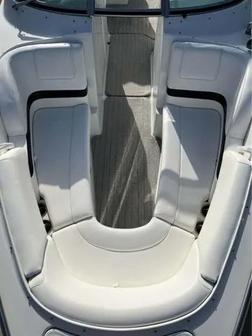Slide: The Image of 2008 Formula 260 Bow Rider boat interior with white seating and gray flooring. - 11