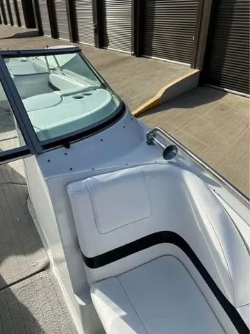 Slide: The Image of 2008 Formula 260 Bow Rider boat with white seating and sleek design. - 14